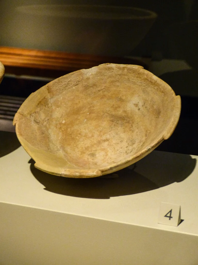 Ancient marble bowl containing yellow ochre pigment residue